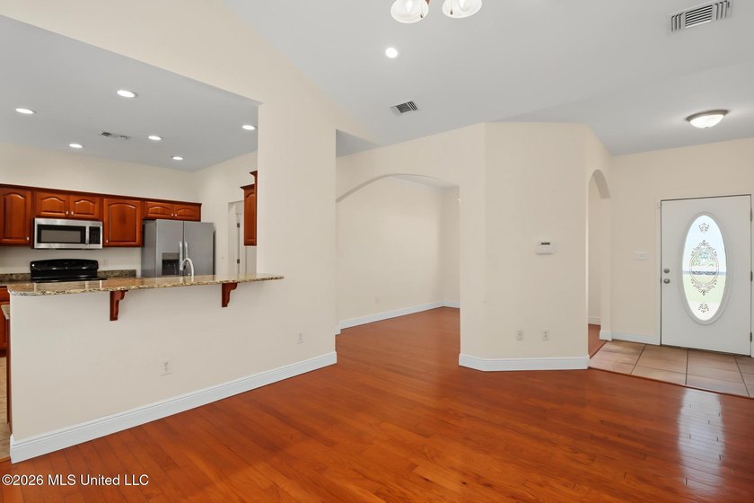 Move-in ready and just minutes from the beach! This beautiful - photo 4