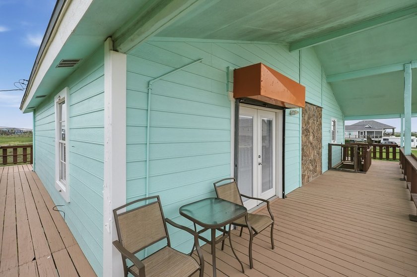 Nestled on two spacious lots in Holiday Beach, this fully - photo 4