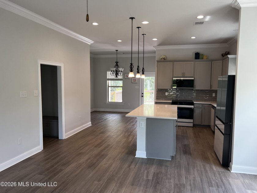This stunning brick home immediately catches the eye with its - photo 6
