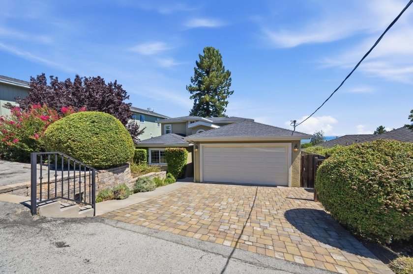 Perched on a picturesque Emerald Hills street, this beautifully - photo 2