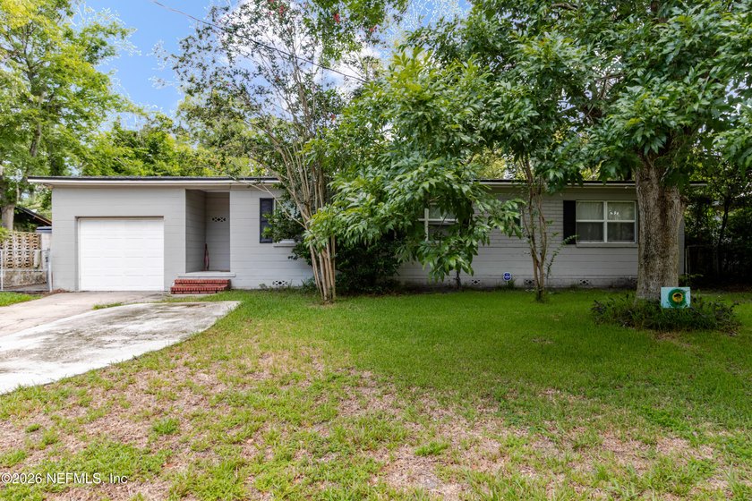 Welcome home to 6501 Mitford Rd! This charming 3-bedroom, 2-bath - photo 2