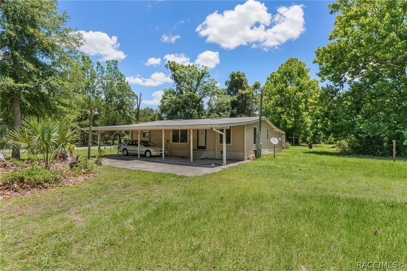 Discover the potential of this 2.14-acre corner lot property in - photo 2