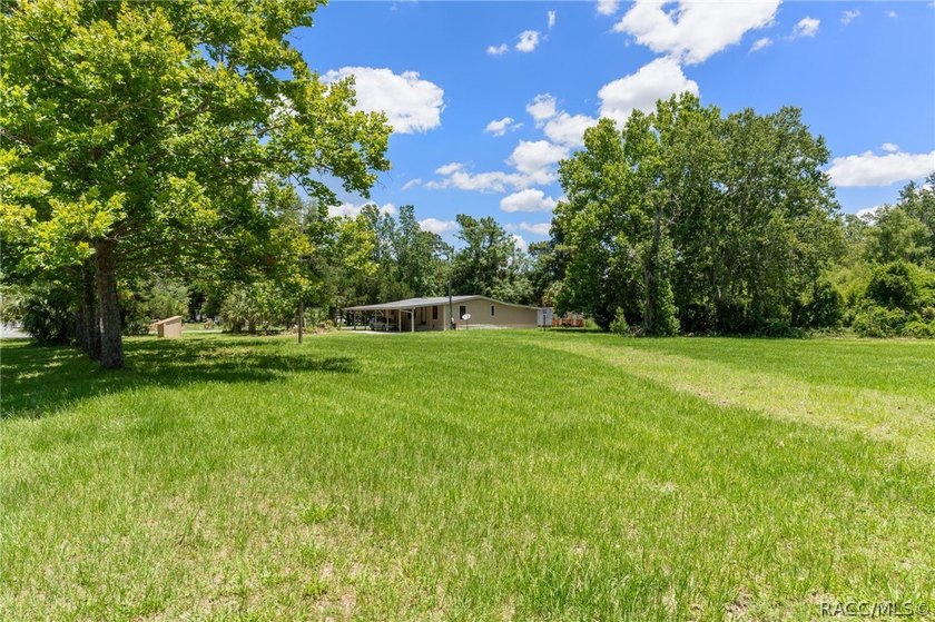 Discover the potential of this 2.14-acre corner lot property in - photo 3