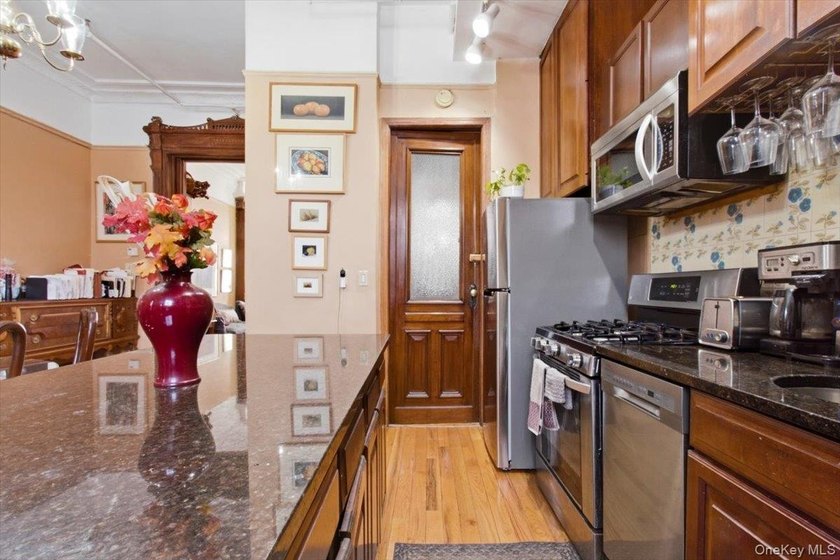 This meticulously maintained residence offers a spacious - photo 11