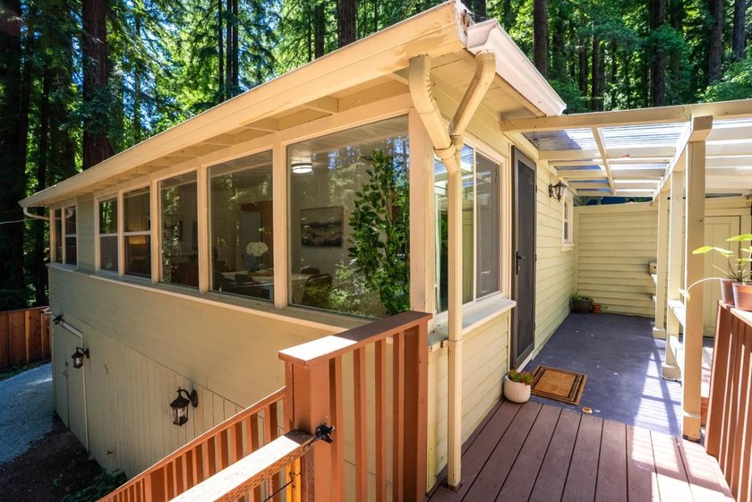 Nestled beneath a canopy of majestic redwood trees on a spacious - photo 3