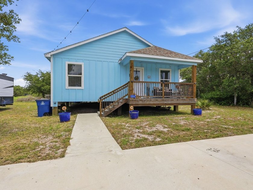 Built in 2021, this 3-bedroom, 2-bath coastal cottage sits on - photo 2