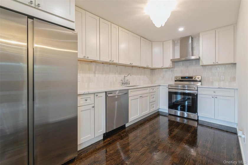 Welcome home to this beautifully renovated 4 bedroom, 2 full - photo 16