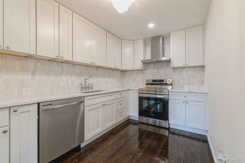Welcome home to this beautifully renovated 4 bedroom, 2 full - photo 18