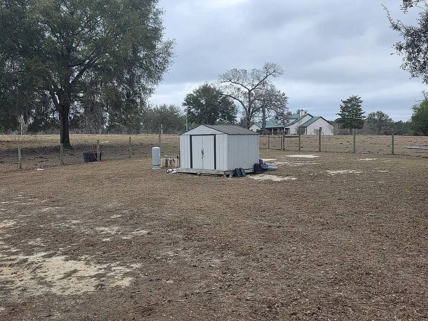 Set on 10 acres, this 4-bedroom, 2-bath home offers space - photo 7