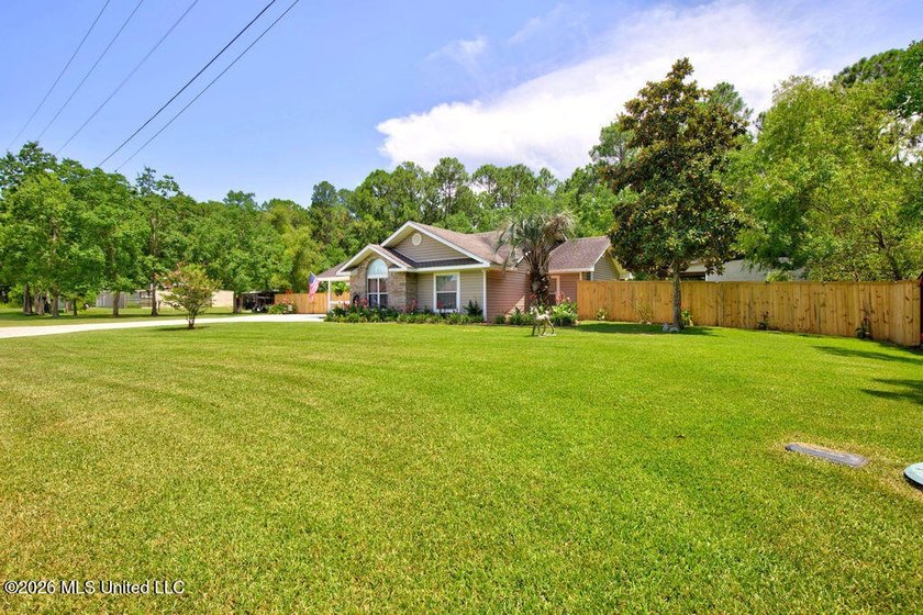 Welcome home to this inviting 4-bedroom, 2-bath home situated on - photo 3