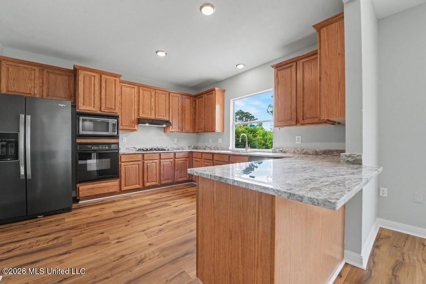 Beautifully updated 4-bedroom, 3-bath home located in the highly - photo 9