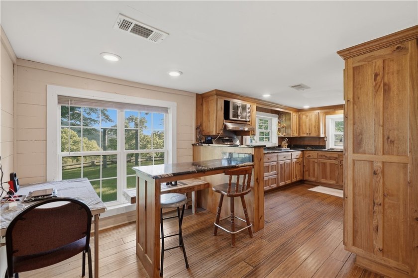 Positioned on 5.14 acres in a scenic Ozark Mountain setting near - photo 8