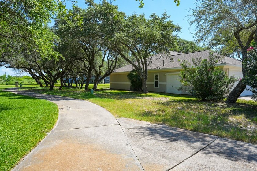 Nestled beneath a canopy of majestic oak trees and overlooking - photo 3