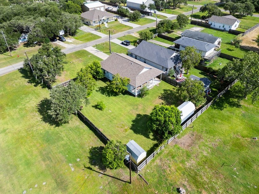 Situated on two spacious lots, this charming 3-bedroom, 2-bath - photo 2