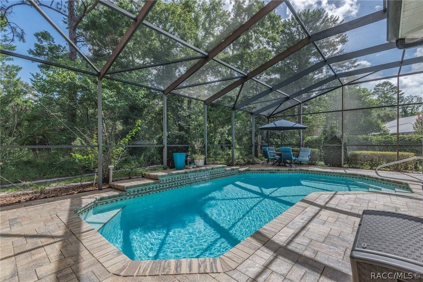 EXQUISTIE FLORIDA LIVING ABOUNDS IN THIS INVITING 3/2/2 WITH DEN - photo 2