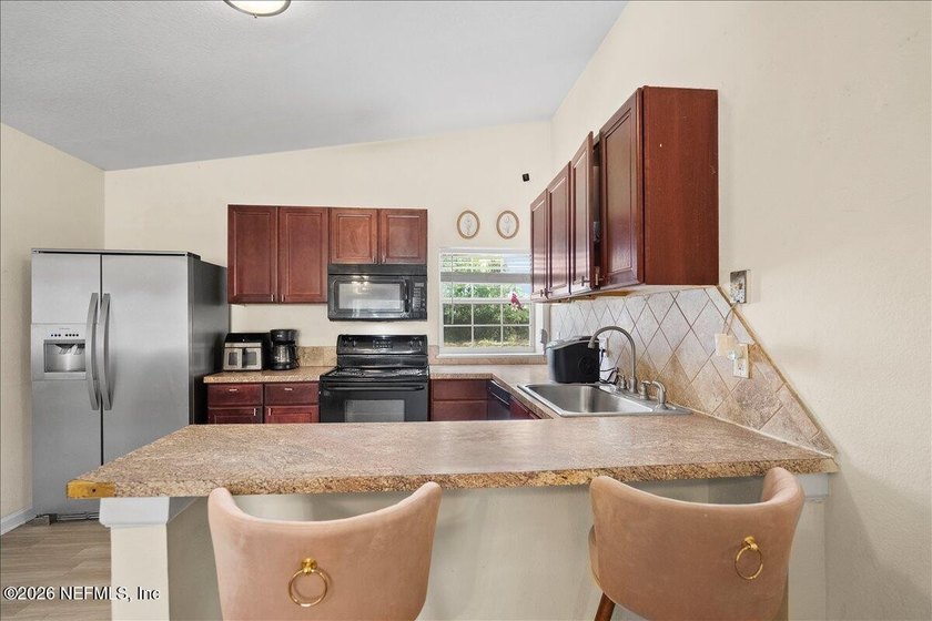 Energy efficient living meets timeless charm! Welcome to 9823 - photo 4