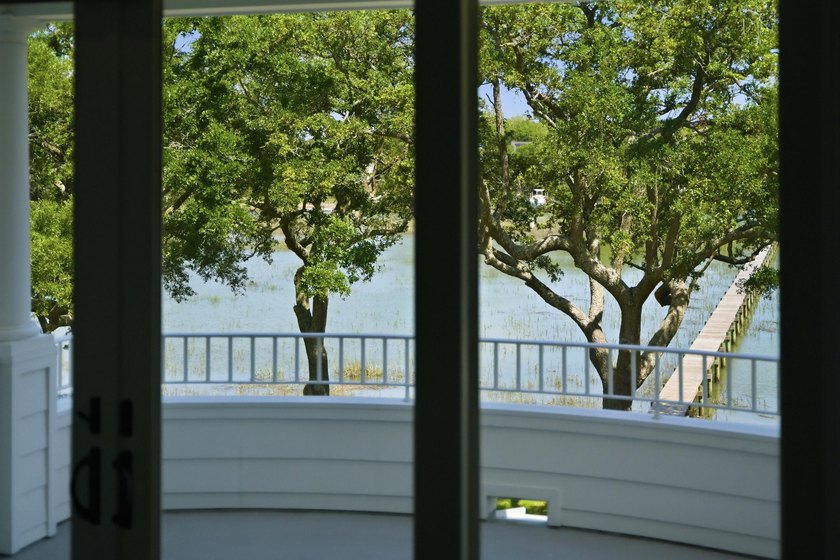 This elevated waterfront home with a private dock has been - photo 35