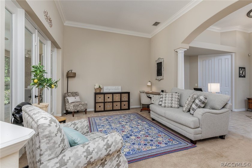 EXQUISTIE FLORIDA LIVING ABOUNDS IN THIS INVITING 3/2/2 WITH DEN - photo 10
