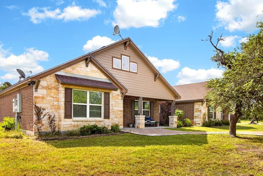 Welcome to Coastal Wild Wood, y'all! This 4-bedroom, 3-bath - photo 3