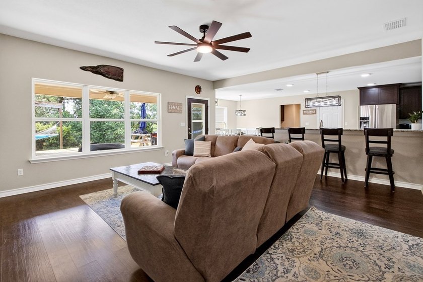 Welcome to Coastal Wild Wood, y'all! This 4-bedroom, 3-bath - photo 4