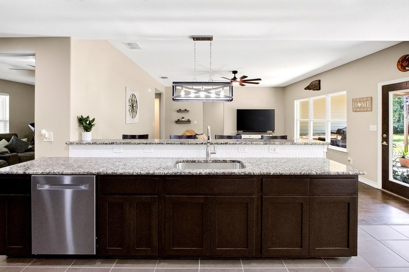 Welcome to Coastal Wild Wood, y'all! This 4-bedroom, 3-bath - photo 7