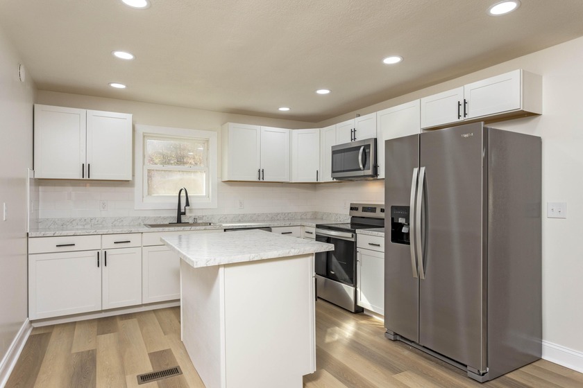 Welcome to this stunning, completely renovated 4-bedroom - photo 2
