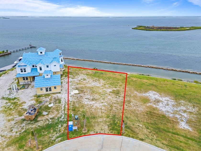 Discover an exceptional bayfront homesite in the prestigious - photo 2