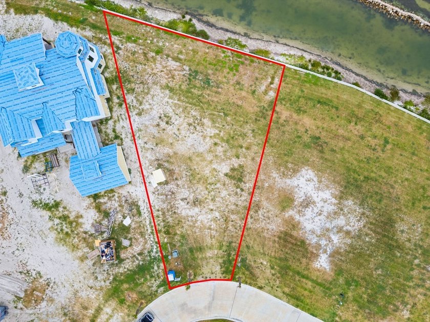 Discover an exceptional bayfront homesite in the prestigious - photo 7