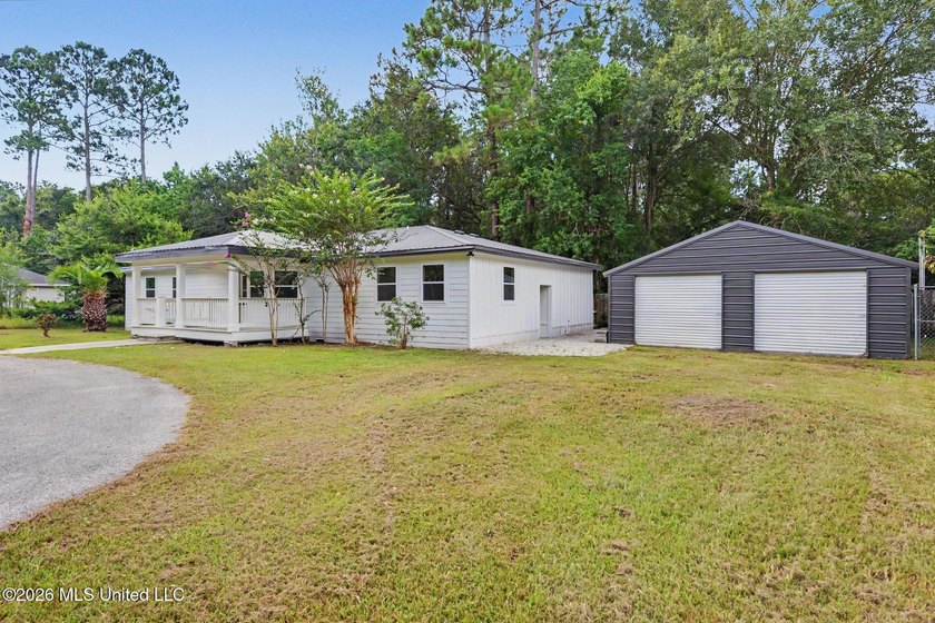 What a beautifully remodeled home on two lots with a metal - photo 2