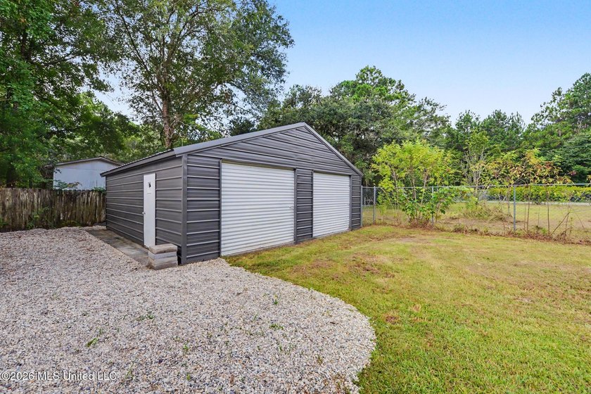 What a beautifully remodeled home on two lots with a metal - photo 3