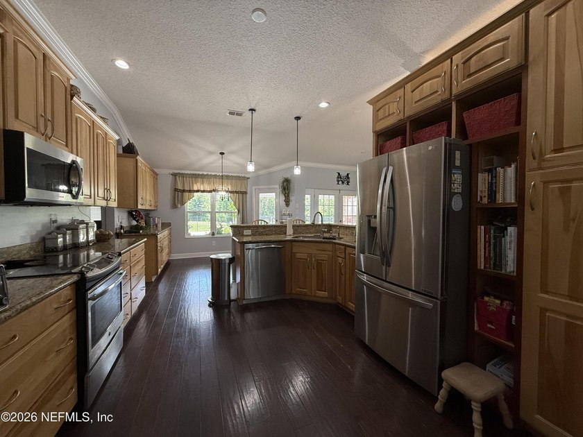 Set in a quiet, established neighborhood, this all-brick 4BR/3BA - photo 7