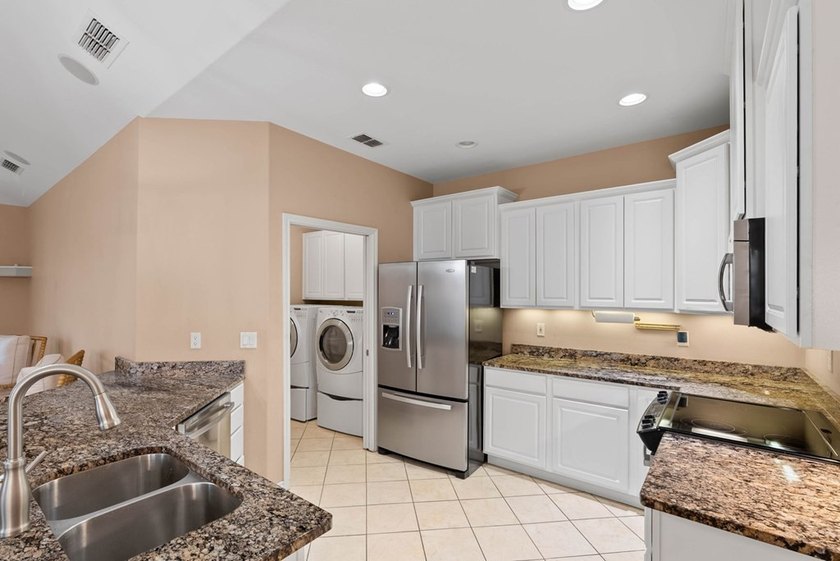 Designed with an attractive open-concept floor plan, the - photo 10