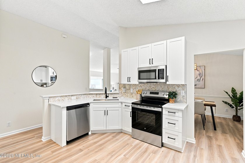 RARE LAKEFRONT OPPORTUNITY! Wake up to breathtaking water views - photo 10