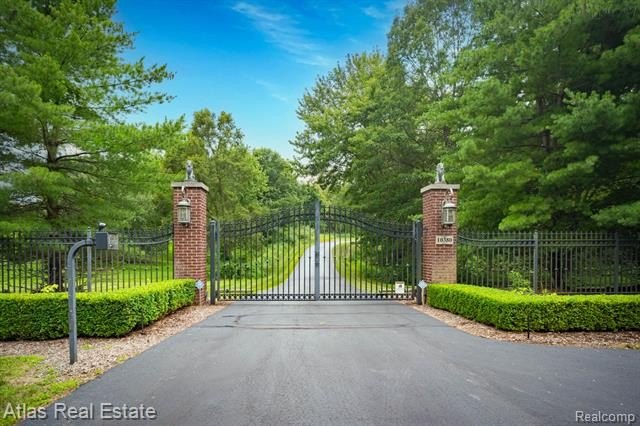 Enter the private estate through a gated front entrance and pass - photo 3