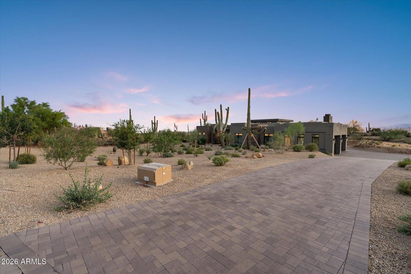 Completed in 2025, this custom home in Desert Ranch offers - photo 2
