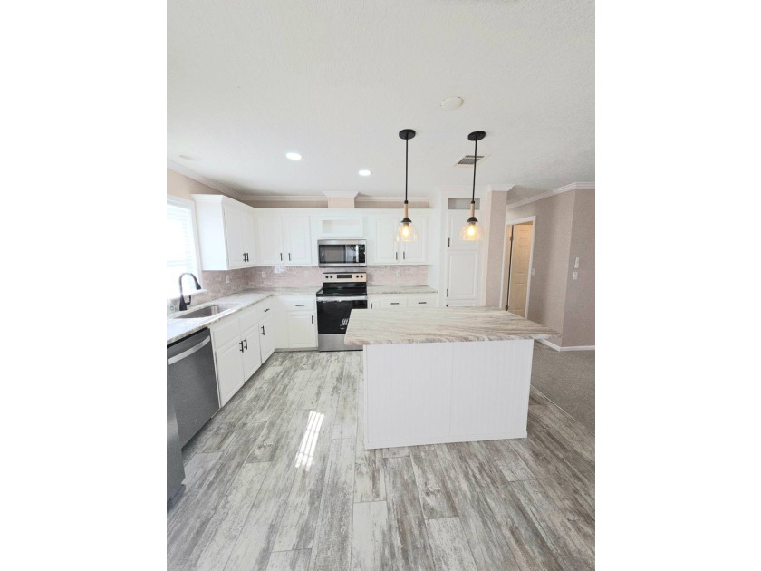 This Beautiful MOVE IN READY 2022 Jacobsen 2 Bed 2 Bath Home is - photo 6