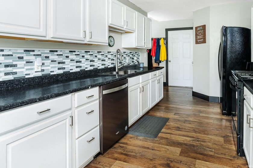 Four bedrooms, two baths, and 1,473 square feet with an open - photo 11