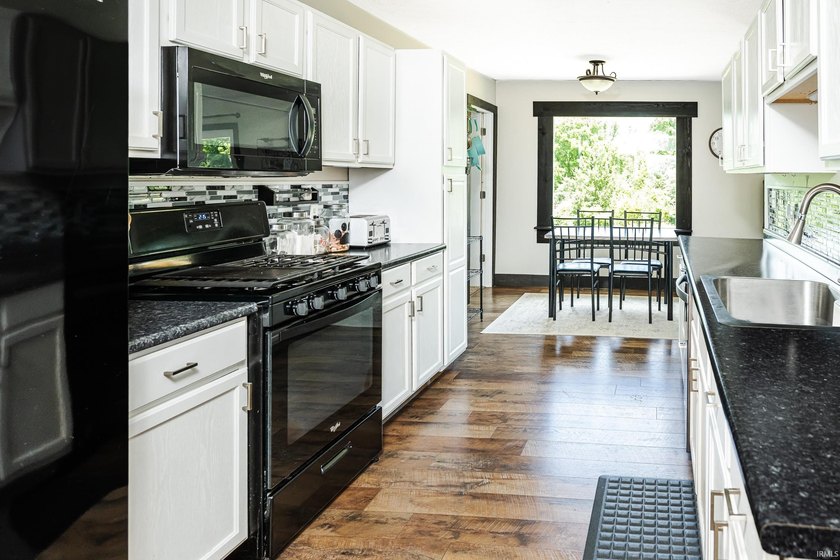Four bedrooms, two baths, and 1,473 square feet with an open - photo 12