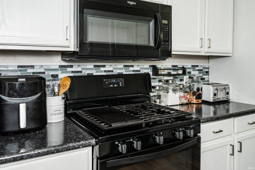 Four bedrooms, two baths, and 1,473 square feet with an open - photo 14