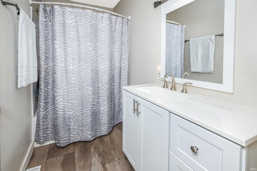 Four bedrooms, two baths, and 1,473 square feet with an open - photo 21