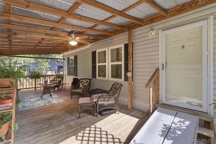 Framed by a canopy of mature trees and lush landscaping, this - photo 7