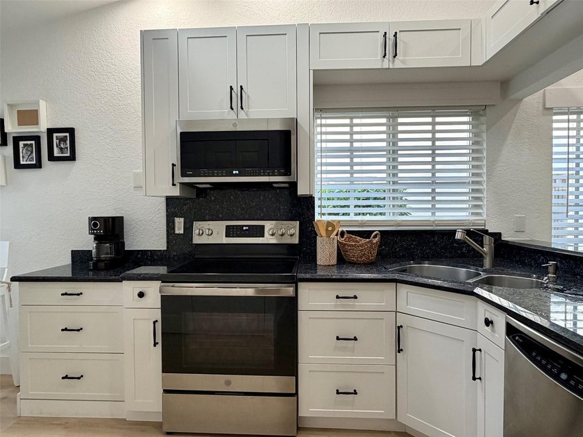 All ages Updated 2BR/2BA corner condo with the feel of a - photo 5