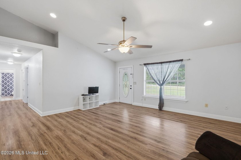 Welcome home to this spacious 4BR/2BA residence offering the - photo 2