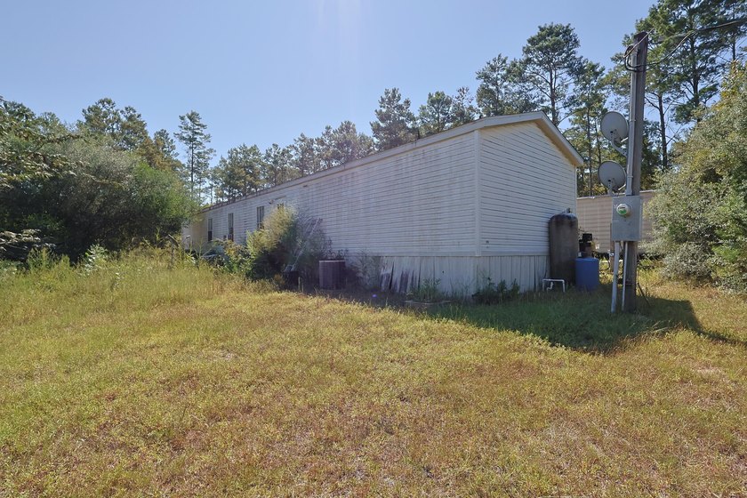 Freeport 5-acre parcel with 3BR/2BA mobile home (2000). Wooded - photo 17