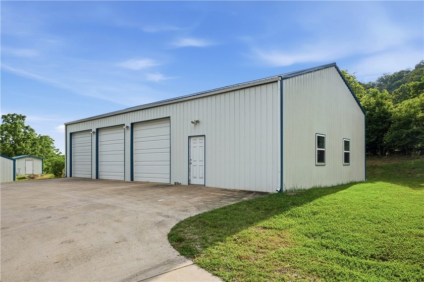 Positioned on 5.14 acres in a scenic Ozark Mountain setting near - photo 17