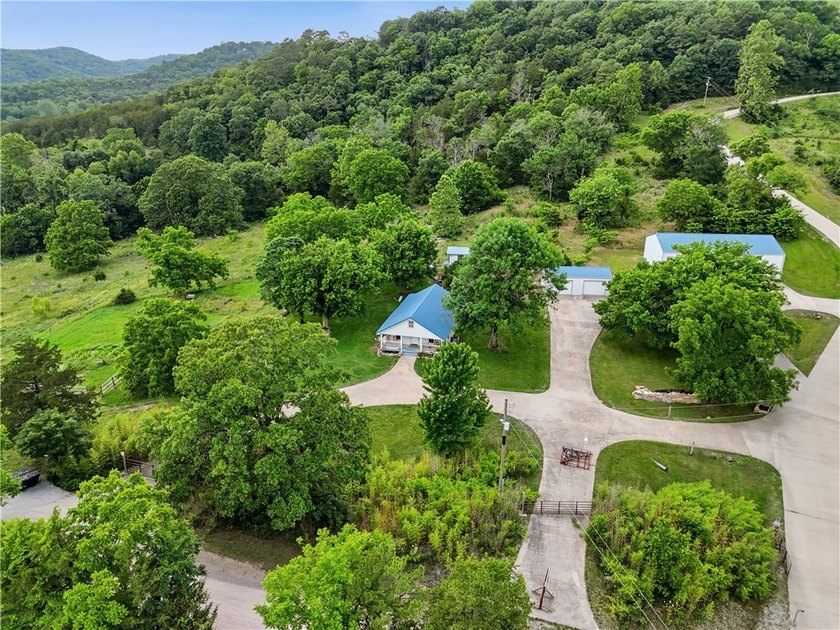 Positioned on 5.14 acres in a scenic Ozark Mountain setting near - photo 19