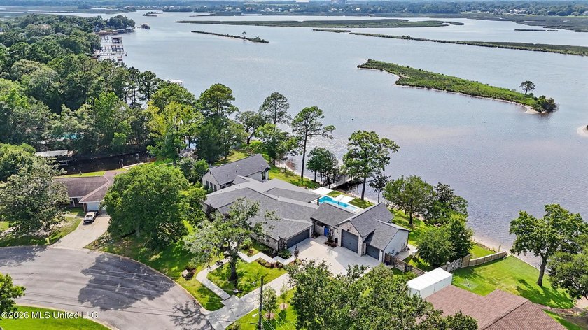 Spread across two waterfront lots along the Tchoutacabouffa - photo 2