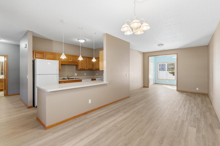 This well-maintained one-level townhome offers approximately 1 - photo 3