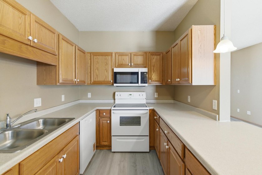This well-maintained one-level townhome offers approximately 1 - photo 10