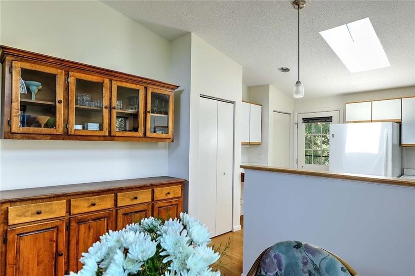 This well-maintained townhouse-style condominium is located in - photo 11